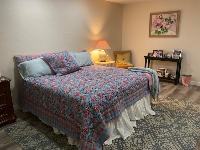 bedroom with hardwood / wood-style flooring