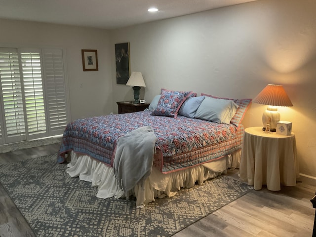 bedroom featuring recessed lighting, baseboards, and wood finished floors