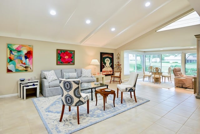 living room featuring high vaulted ceiling, baseboards, light tile patterned floors, and a wealth of natural light