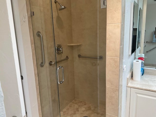 bathroom with vanity and walk in shower