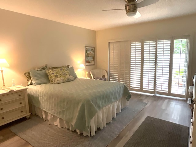 bedroom with hardwood / wood-style flooring and ceiling fan