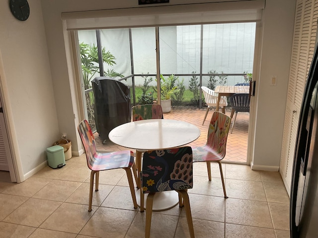 dining space with light tile patterned floors