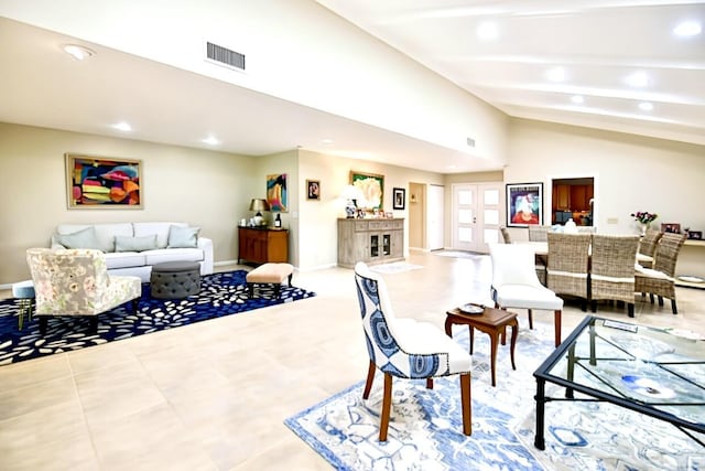 living room featuring baseboards, vaulted ceiling with beams, visible vents, and recessed lighting