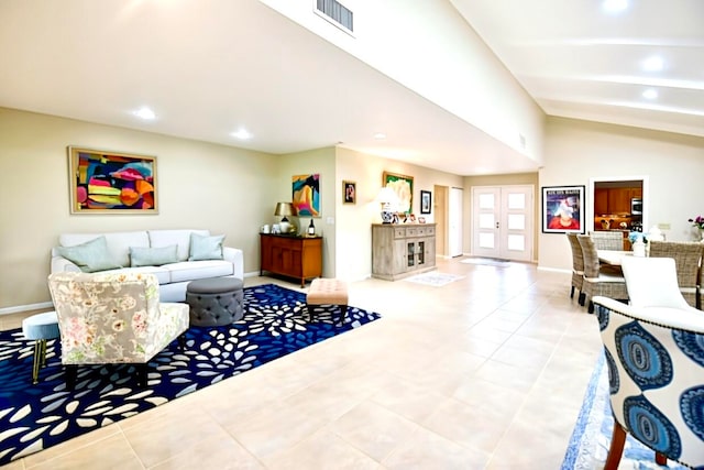 tiled living room featuring french doors