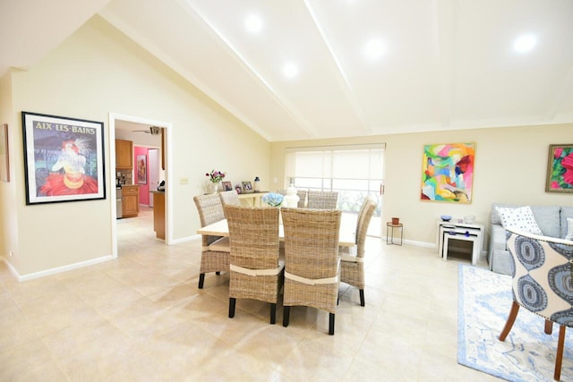 dining area with lofted ceiling with beams, baseboards, and light tile patterned flooring