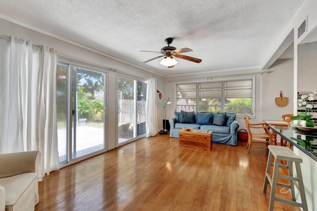 sunroom / solarium featuring ceiling fan and visible vents