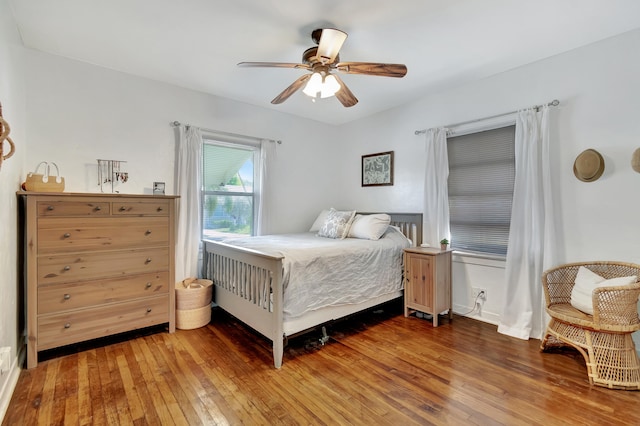 bedroom featuring ceiling fan and hardwood / wood-style flooring