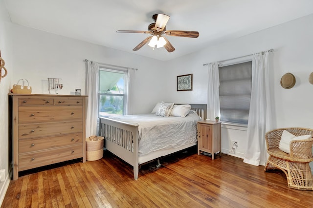 bedroom featuring a ceiling fan and light wood-type flooring