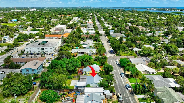 drone / aerial view with a water view and a residential view