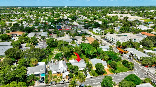 birds eye view of property with a residential view