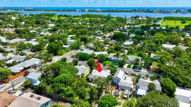 birds eye view of property with a water view