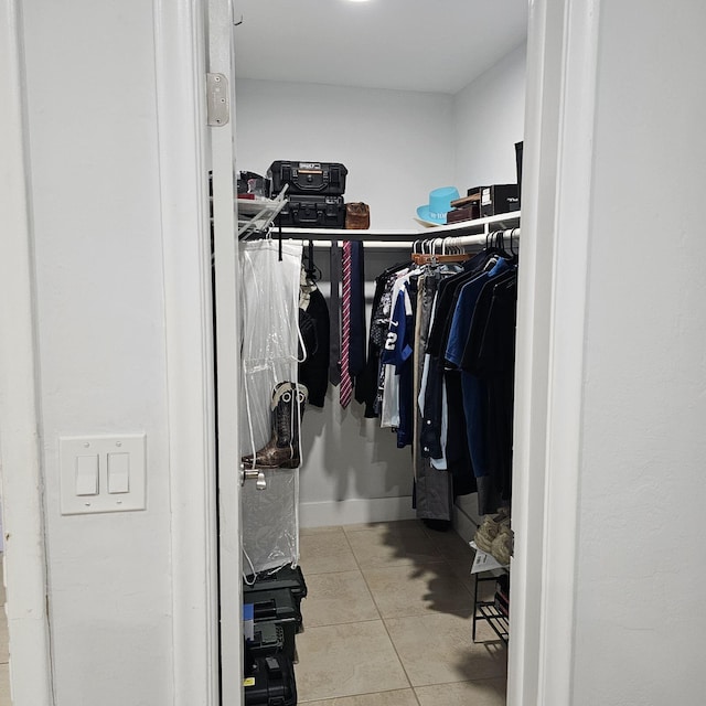 spacious closet with light tile patterned flooring