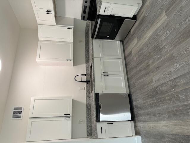 kitchen featuring white cabinets