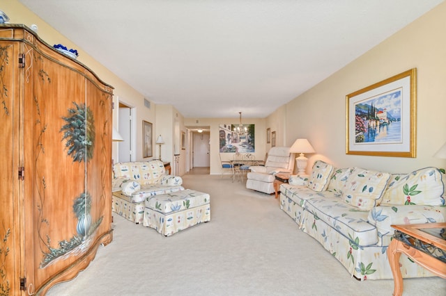 living room featuring light carpet and a chandelier