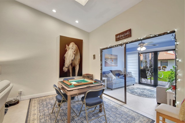 interior space featuring ceiling fan, vaulted ceiling, and tile patterned flooring