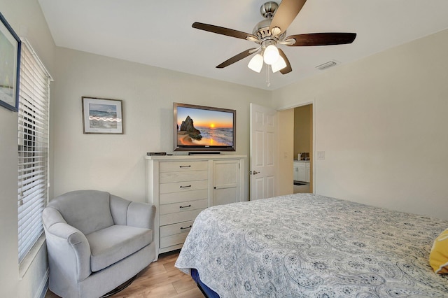 bedroom featuring light hardwood / wood-style flooring, multiple windows, and ceiling fan