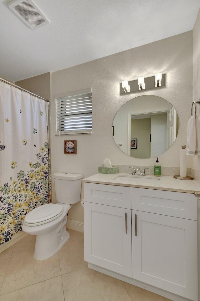 bathroom with vanity, a shower with shower curtain, toilet, and tile patterned flooring