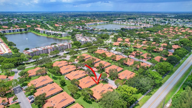 birds eye view of property featuring a water view