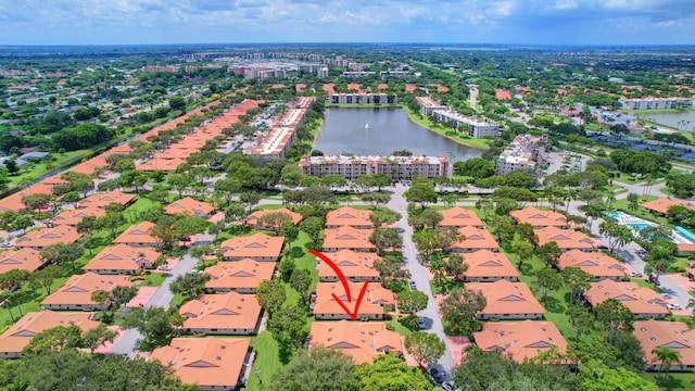 birds eye view of property featuring a water view