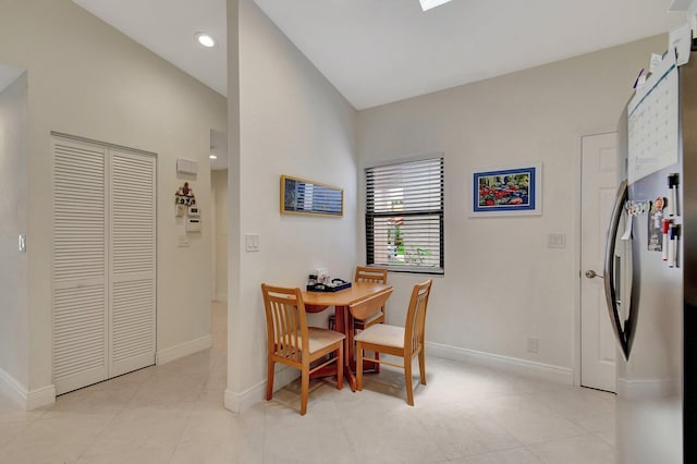 dining area with light tile patterned flooring