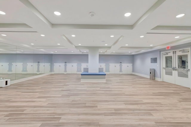 workout area featuring light wood-type flooring