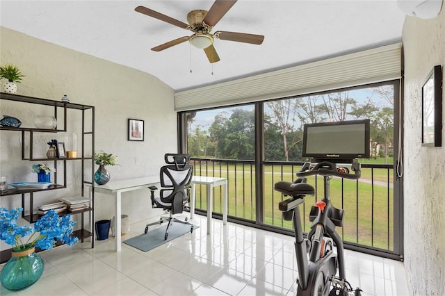 interior space featuring ceiling fan, vaulted ceiling, and a wealth of natural light