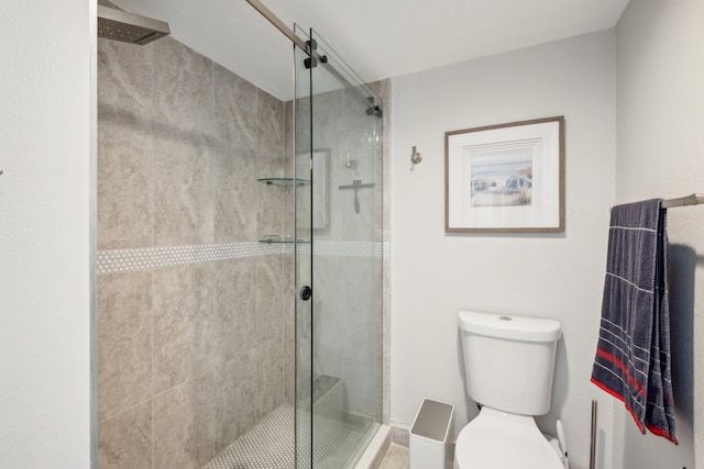 bathroom with walk in shower and toilet