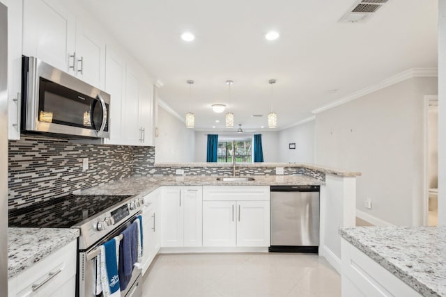 kitchen with stainless steel appliances, decorative light fixtures, tasteful backsplash, kitchen peninsula, and light tile patterned flooring