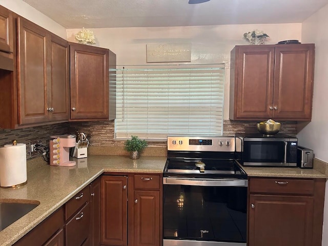 kitchen featuring appliances with stainless steel finishes and backsplash