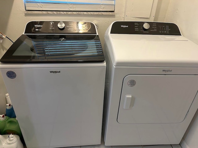 laundry room with washing machine and clothes dryer