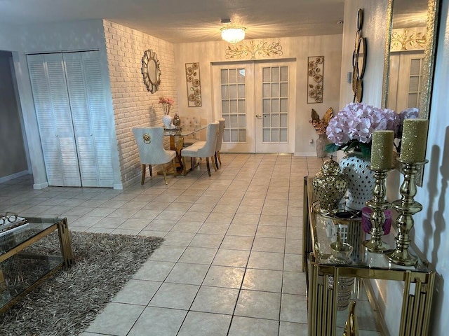 interior space with french doors and light tile patterned floors