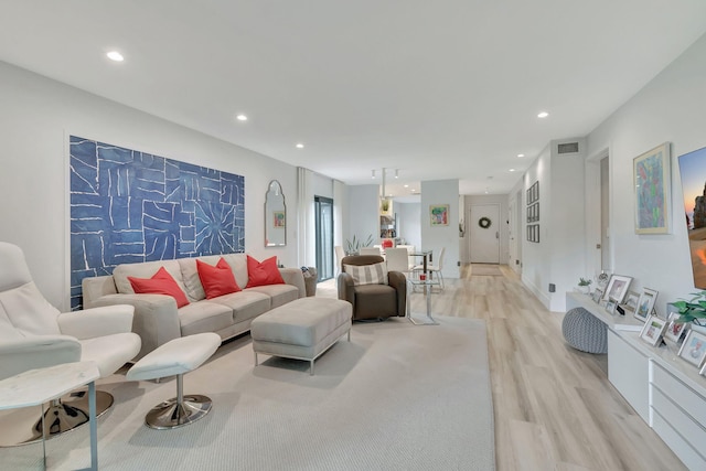 living room with light hardwood / wood-style floors