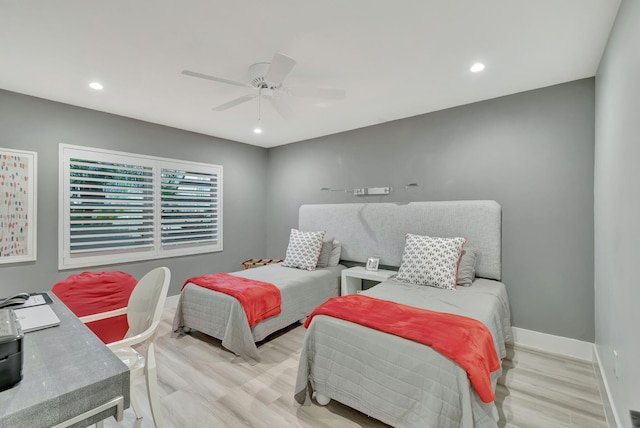 bedroom featuring light hardwood / wood-style flooring and ceiling fan