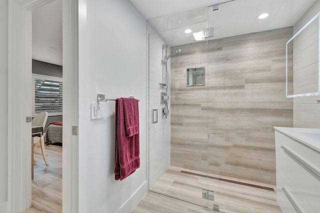 bathroom featuring vanity, hardwood / wood-style floors, and an enclosed shower