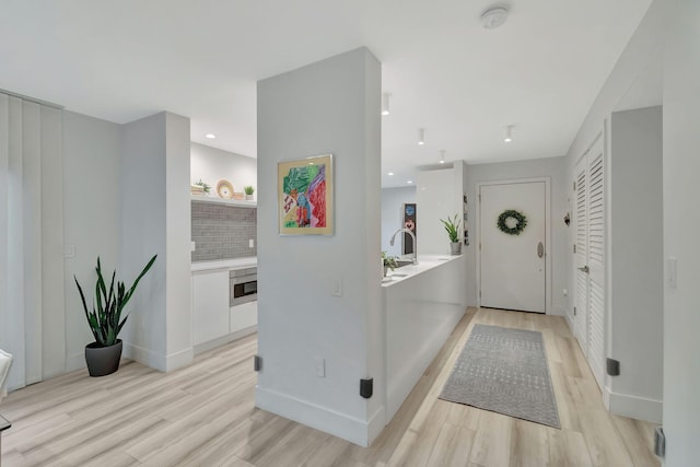 foyer with light hardwood / wood-style floors