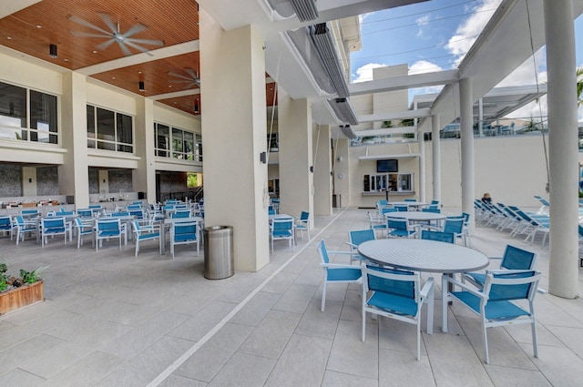 exterior space with ceiling fan and a healthy amount of sunlight