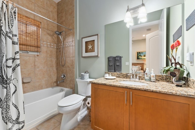 full bathroom with shower / bath combo, tile patterned flooring, toilet, and vanity