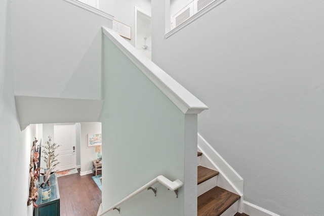 staircase featuring wood-type flooring