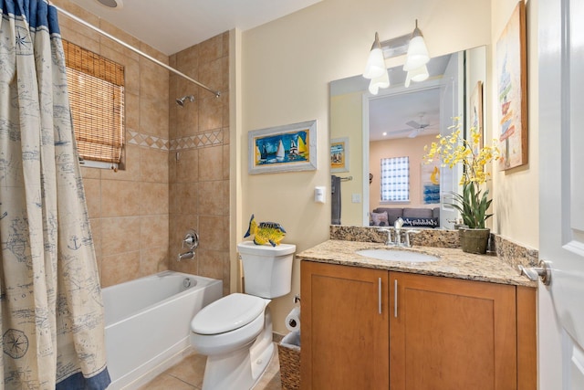 full bathroom with tile patterned floors, toilet, shower / bath combination with curtain, ceiling fan, and vanity