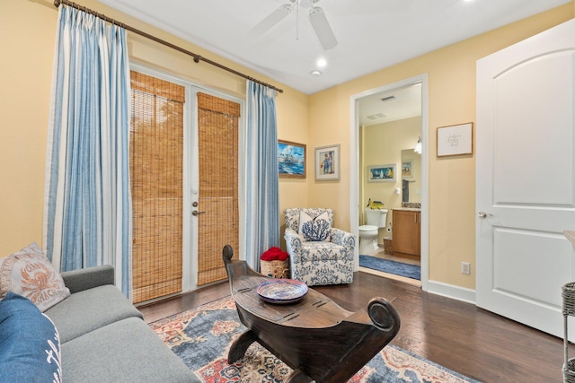 living room with hardwood / wood-style flooring and ceiling fan