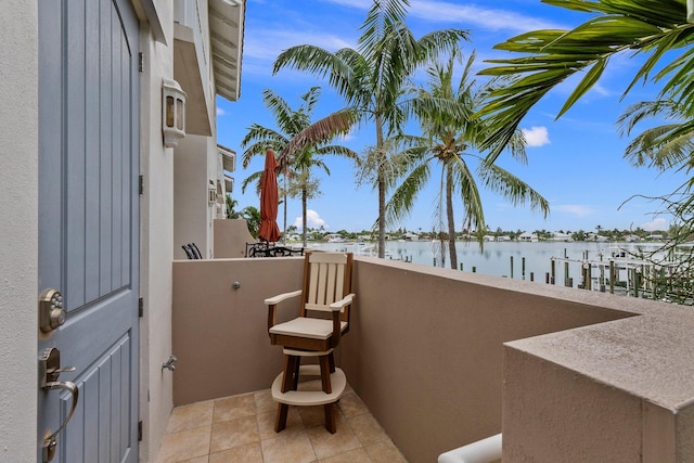 view of patio with a water view