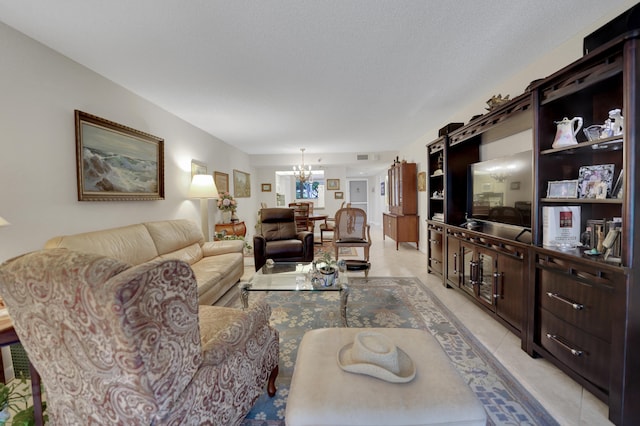 living room with light tile patterned flooring and an inviting chandelier