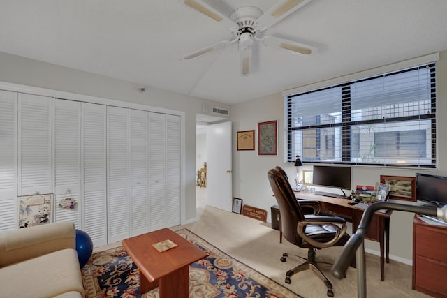 home office with ceiling fan and light colored carpet