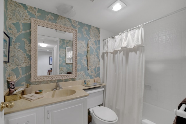 full bathroom featuring toilet, vanity, and shower / bath combo with shower curtain