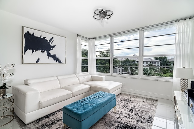 tiled living room with a healthy amount of sunlight