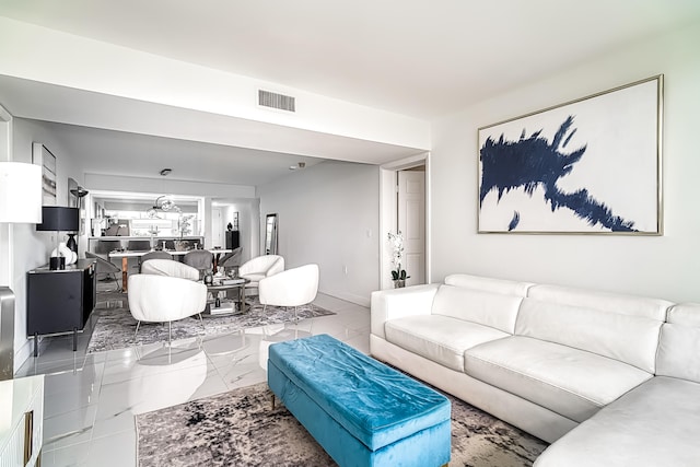 living room with tile patterned flooring