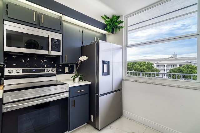 kitchen with light tile patterned floors and appliances with stainless steel finishes