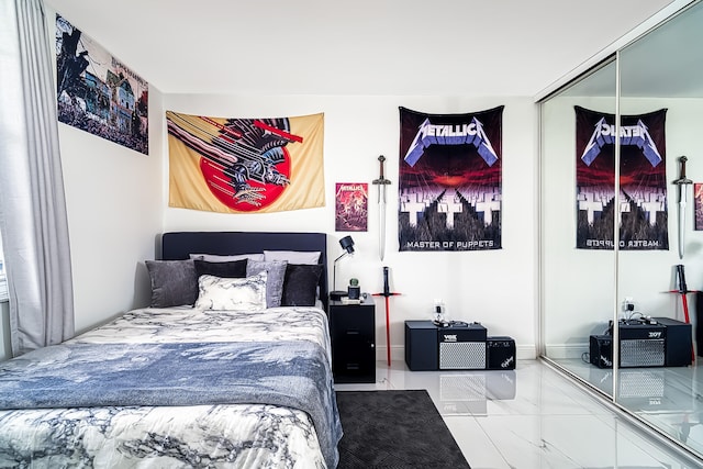 tiled bedroom featuring a closet