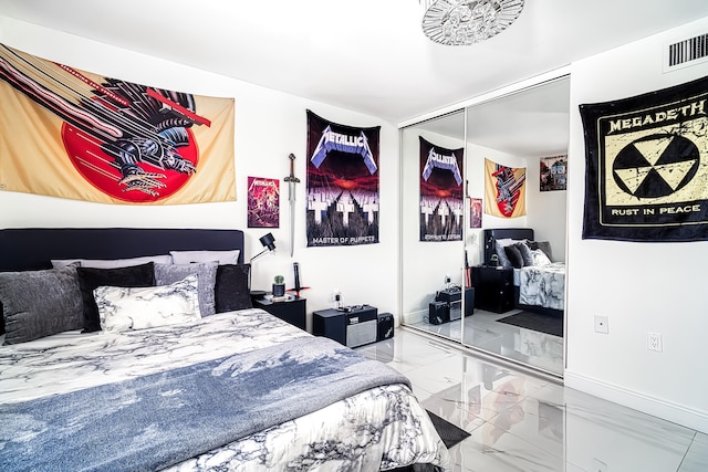 bedroom with a closet and tile patterned floors