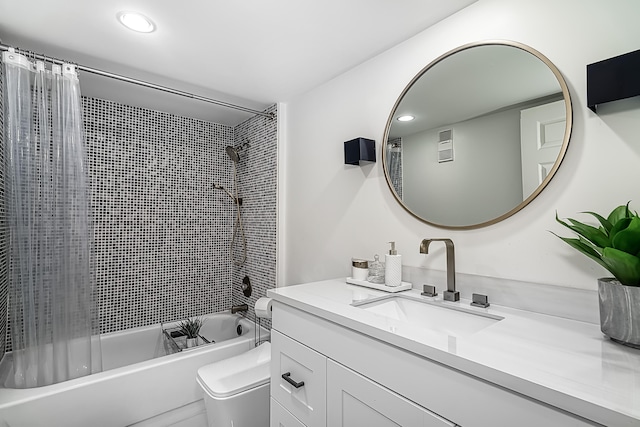 full bathroom with shower / bath combo, toilet, and vanity